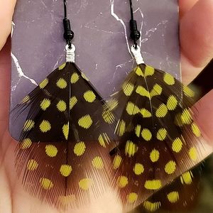Lime green & black feather drop handmade earrings. $Firm.
